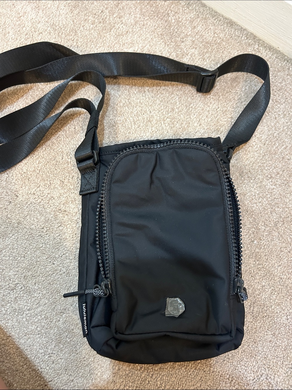lululemon athletica Black universal Crossbody Pouch can hold a diaper/wipes